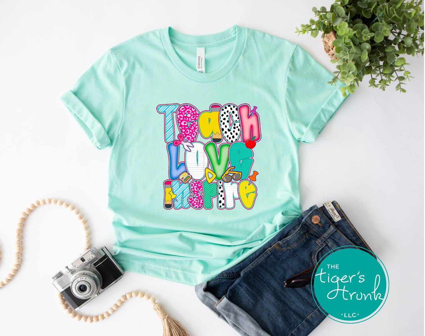 T-shirt with "Teach Love Inspire" message, inspirational and positive graphic tee for teachers and school staff
