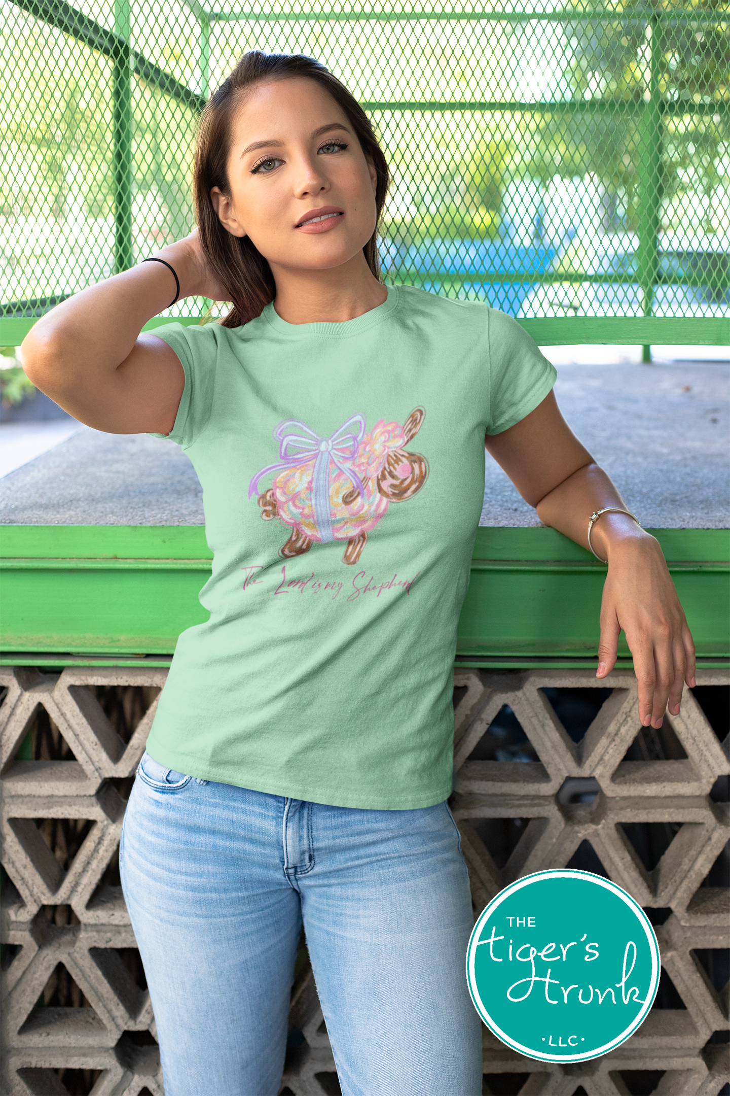 Christian Easter t-shirt with watercolor sheep and Psalm 23:1, featuring the verse "The Lord is my shepherd" in soft, faith-inspired design.