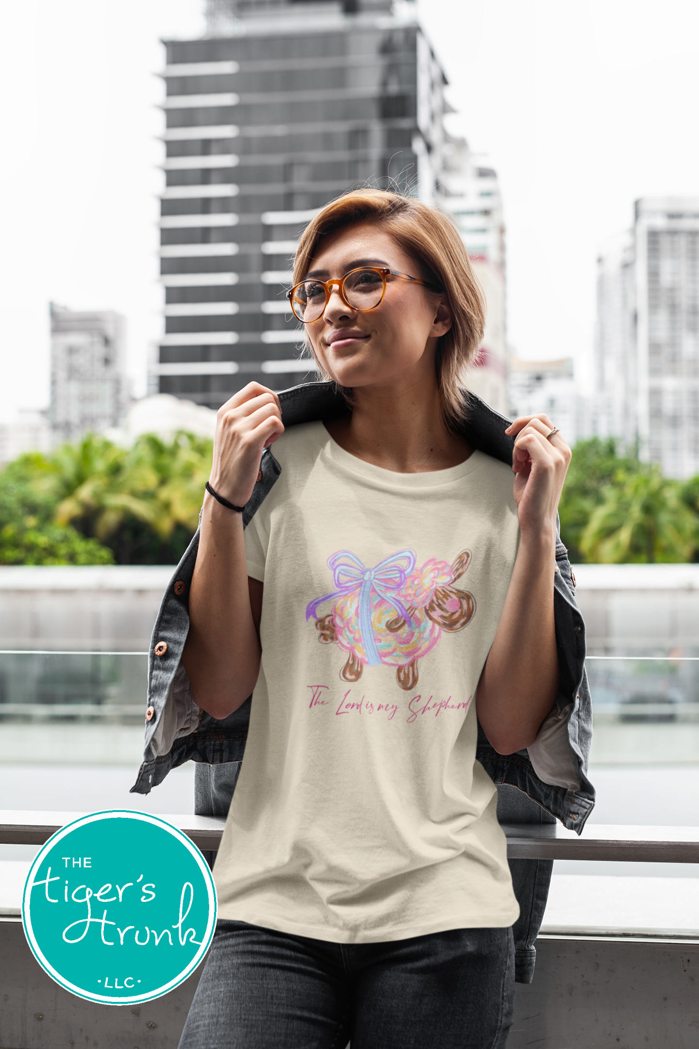 Christian Easter t-shirt with watercolor sheep and Psalm 23:1, featuring the verse "The Lord is my shepherd" in soft, faith-inspired design.
