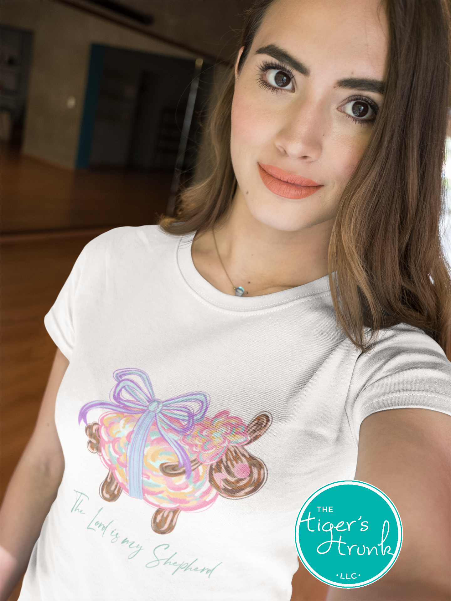 Christian Easter t-shirt with watercolor sheep and Psalm 23:1, featuring the verse "The Lord is my shepherd" in soft, faith-inspired design.
