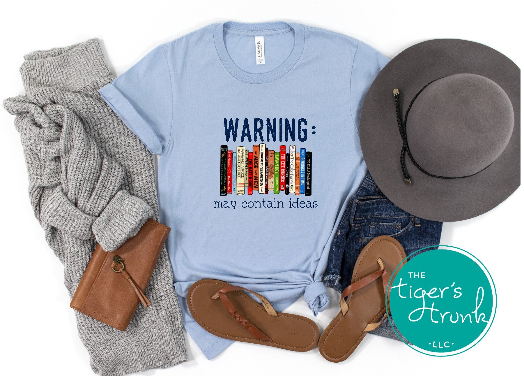 Graphic t-shirt featuring banned books and the phrase "Warning: May Contain Ideas," ideal for librarians, educators, and book lovers