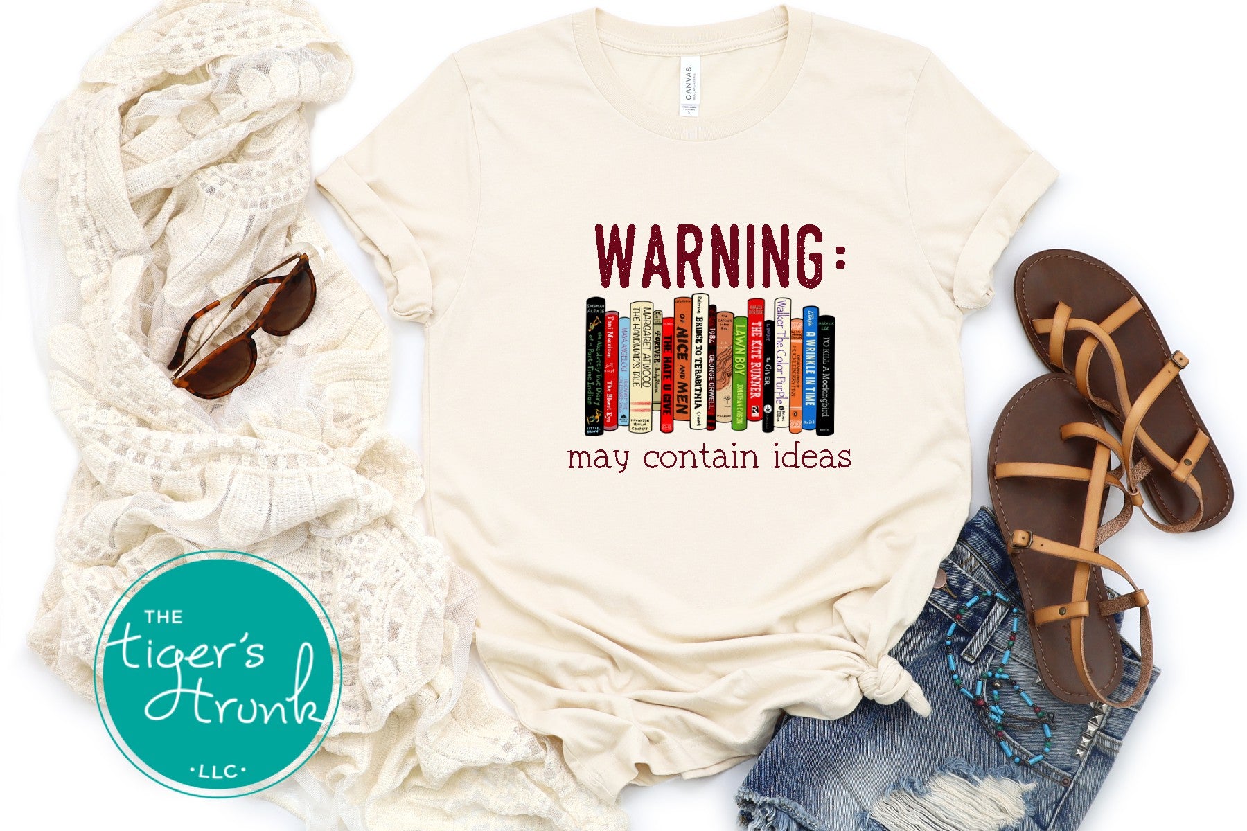 Graphic t-shirt featuring banned books and the phrase "Warning: May Contain Ideas," ideal for librarians, educators, and book lovers