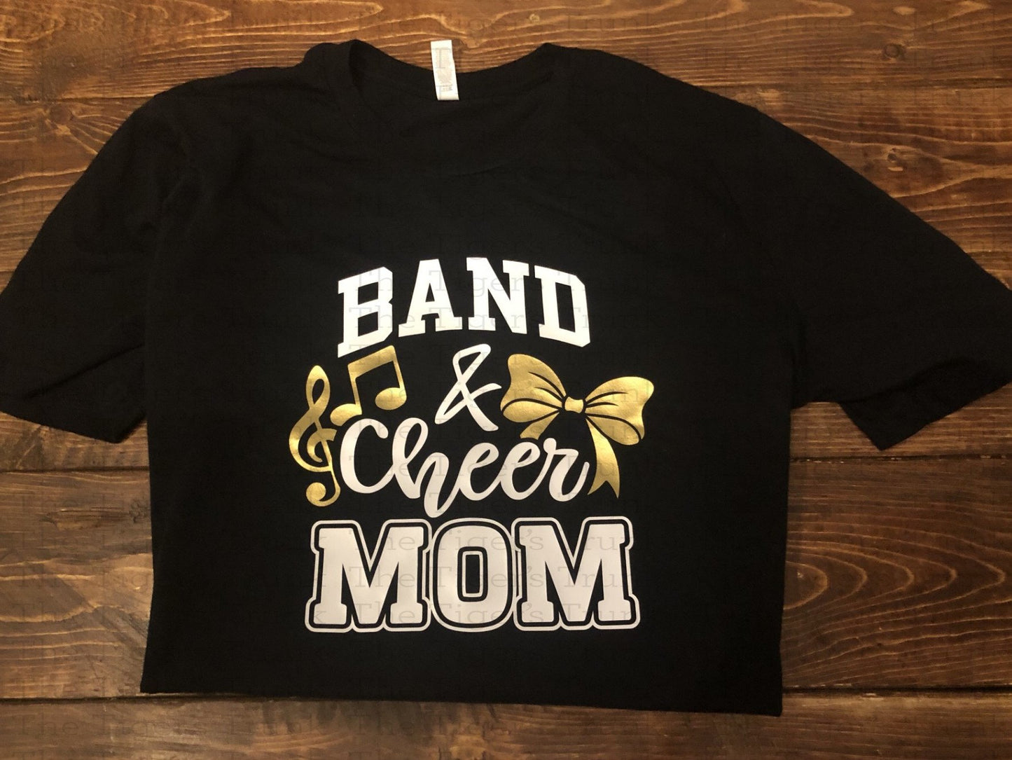 Custom Band and Cheer Mom shirt with bow and music note accents, personalized in school colors for spirited game day wear