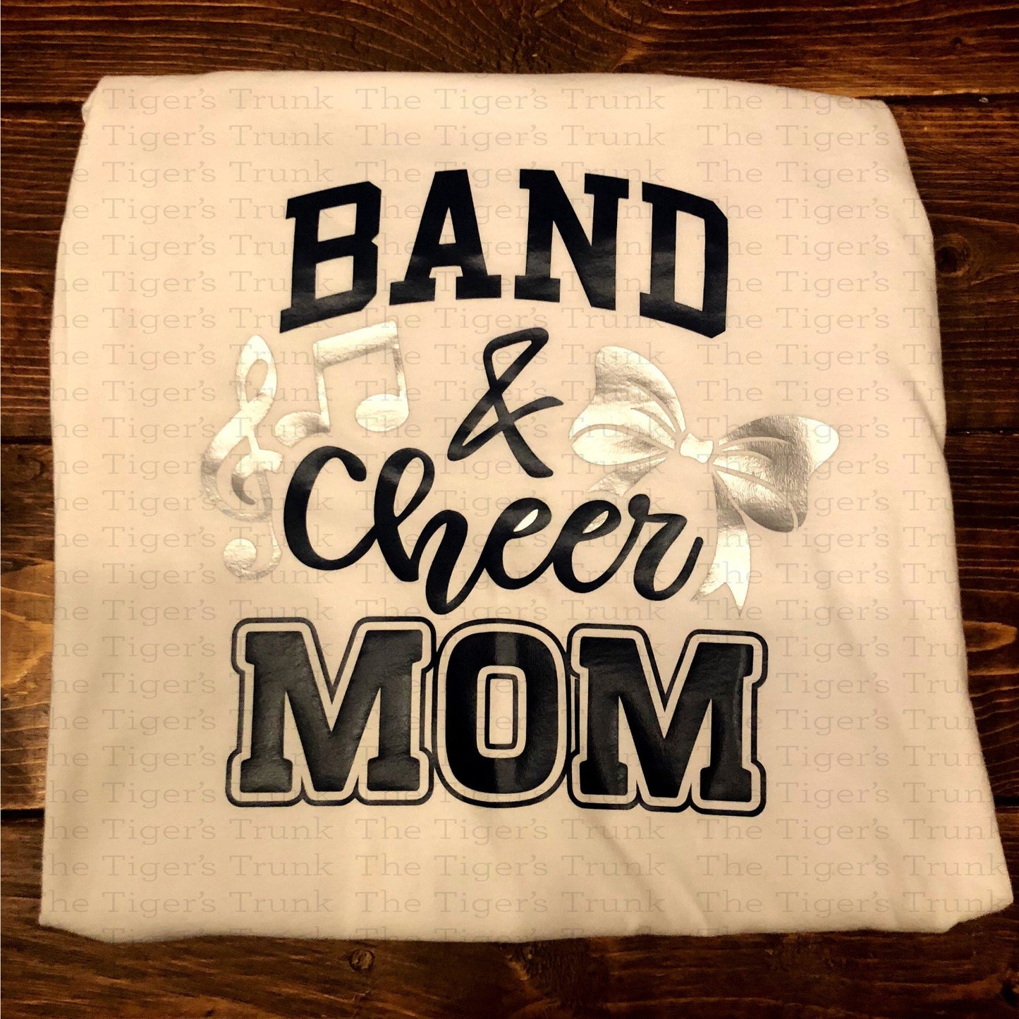 Custom Band and Cheer Mom shirt with bow and music note accents, personalized in school colors for spirited game day wear