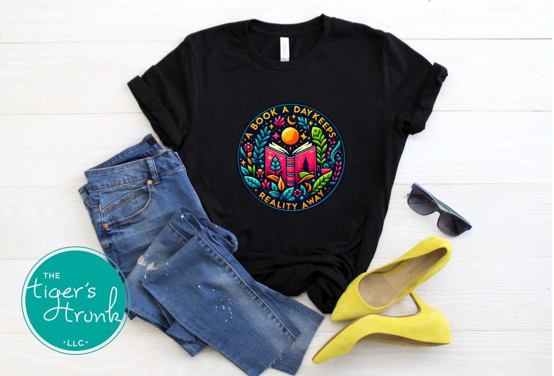 T-shirt with the phrase "A Book a Day Keeps Reality Away," perfect for readers, book lovers, and introverts