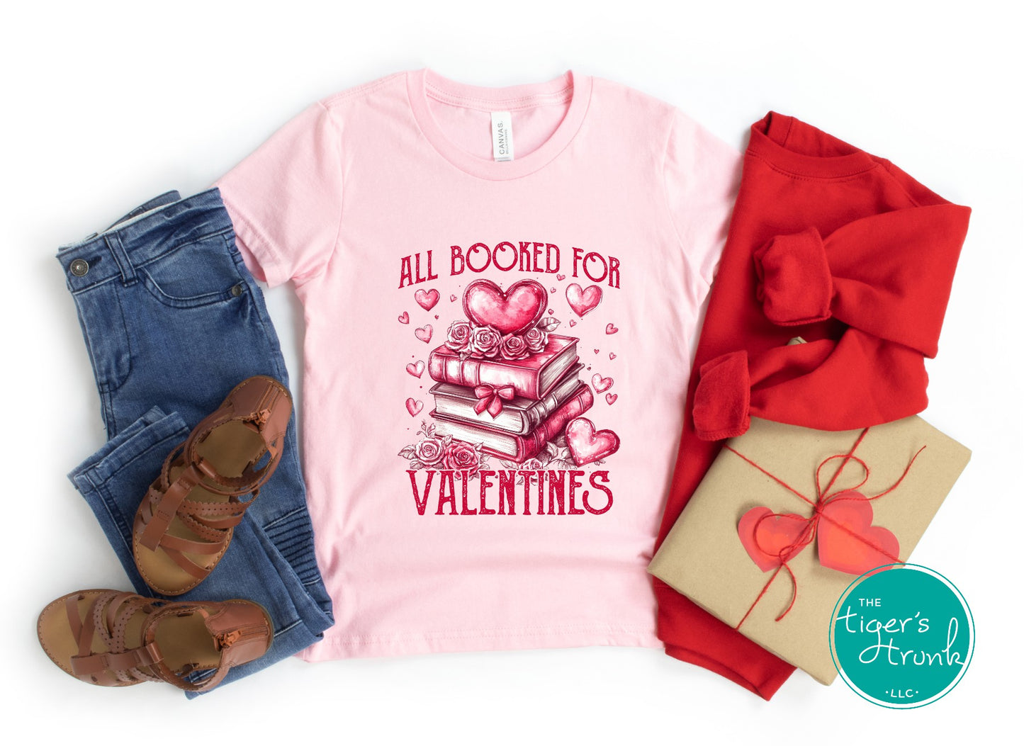 Shirt with stacked books, hearts, and roses, featuring the phrase "All Booked for Valentine’s." Perfect for book lovers.