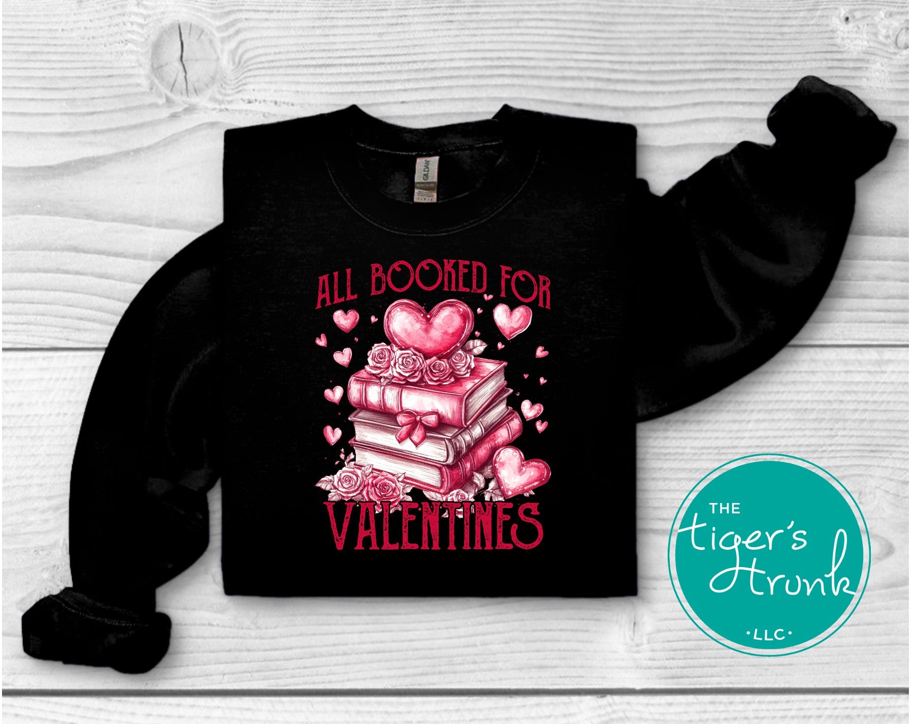 Shirt with stacked books, hearts, and roses, featuring the phrase "All Booked for Valentine’s." Perfect for book lovers.