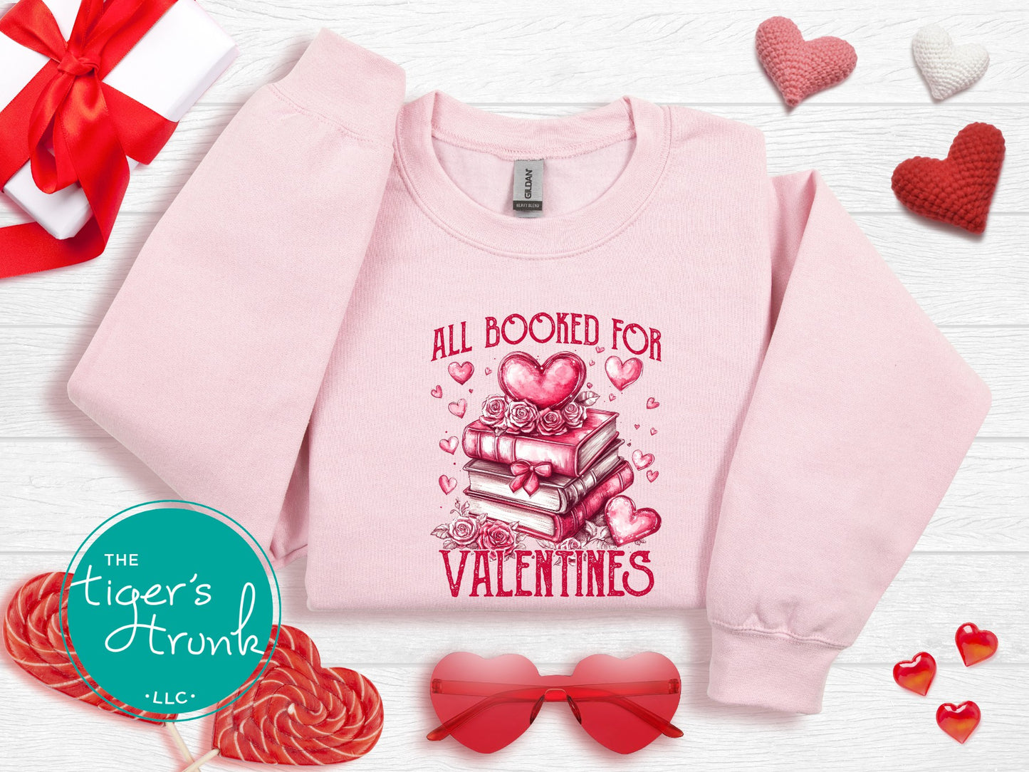 Shirt with stacked books, hearts, and roses, featuring the phrase "All Booked for Valentine’s." Perfect for book lovers.