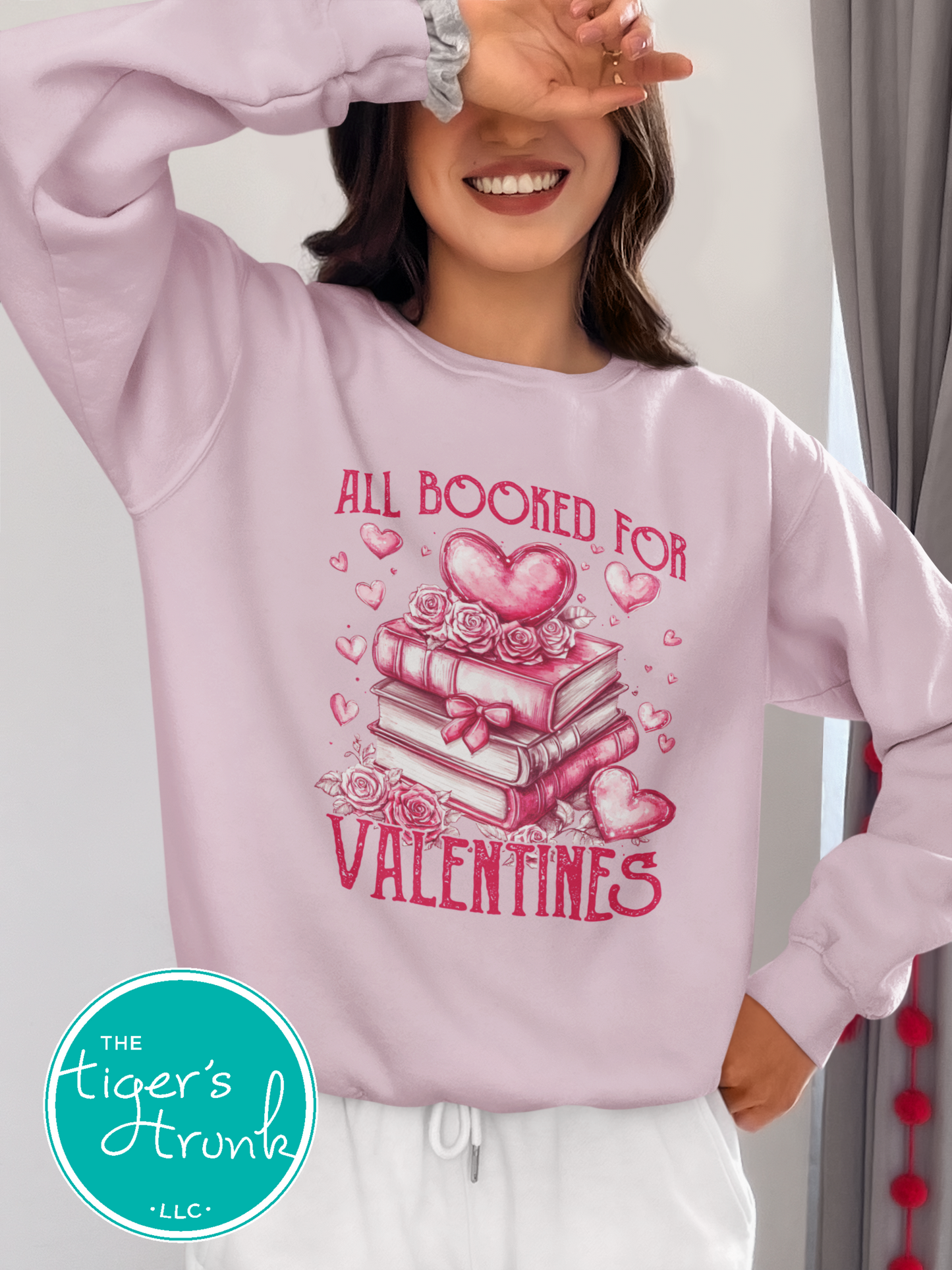 Shirt with stacked books, hearts, and roses, featuring the phrase "All Booked for Valentine’s." Perfect for book lovers.