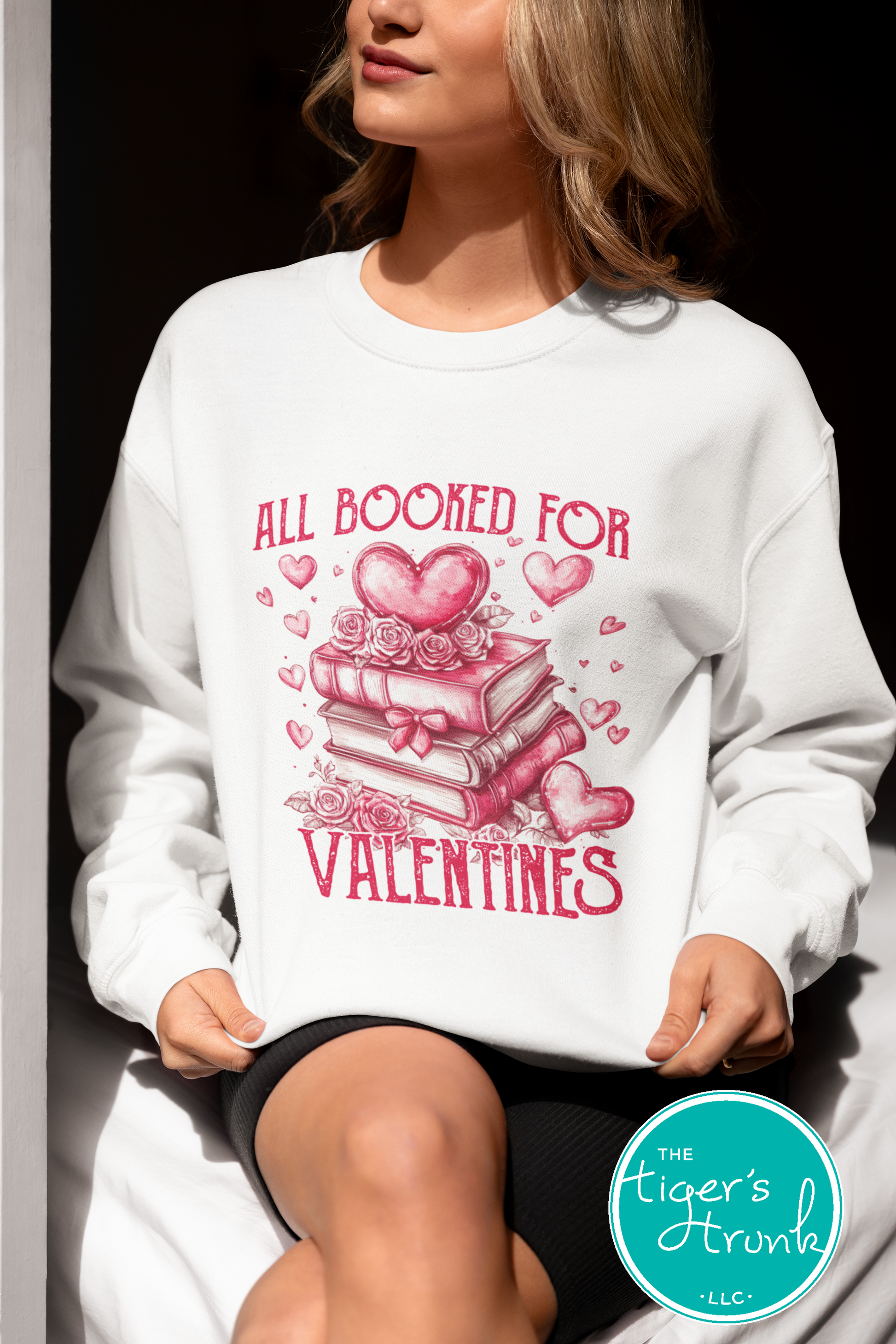 Shirt with stacked books, hearts, and roses, featuring the phrase "All Booked for Valentine’s." Perfect for book lovers.