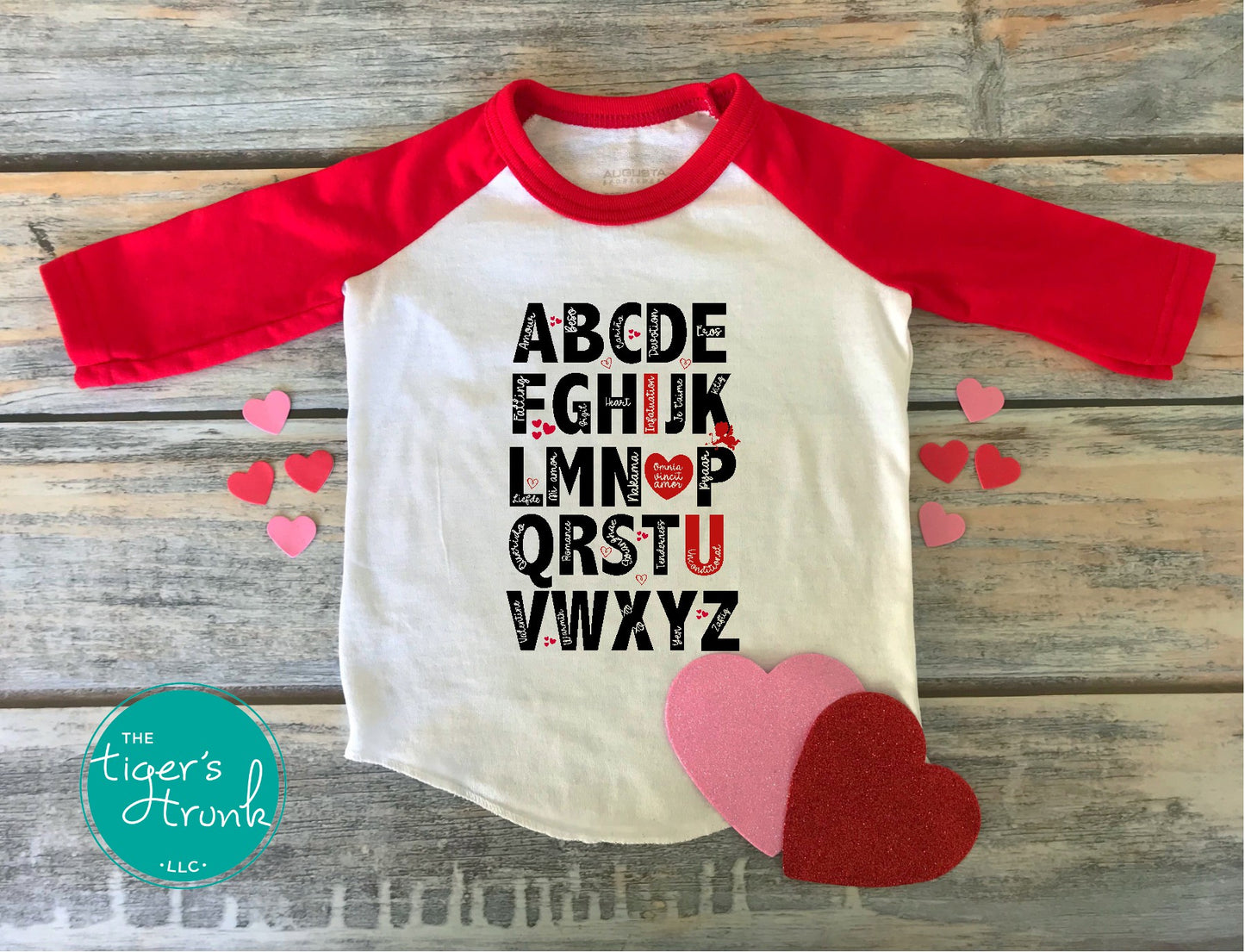 Adorable Valentine's alphabet shirt available in adult and kid sizes. Features a playful A to Z design with love-themed words. Ideal for Valentine's Day parties, matching outfits, and gifts.