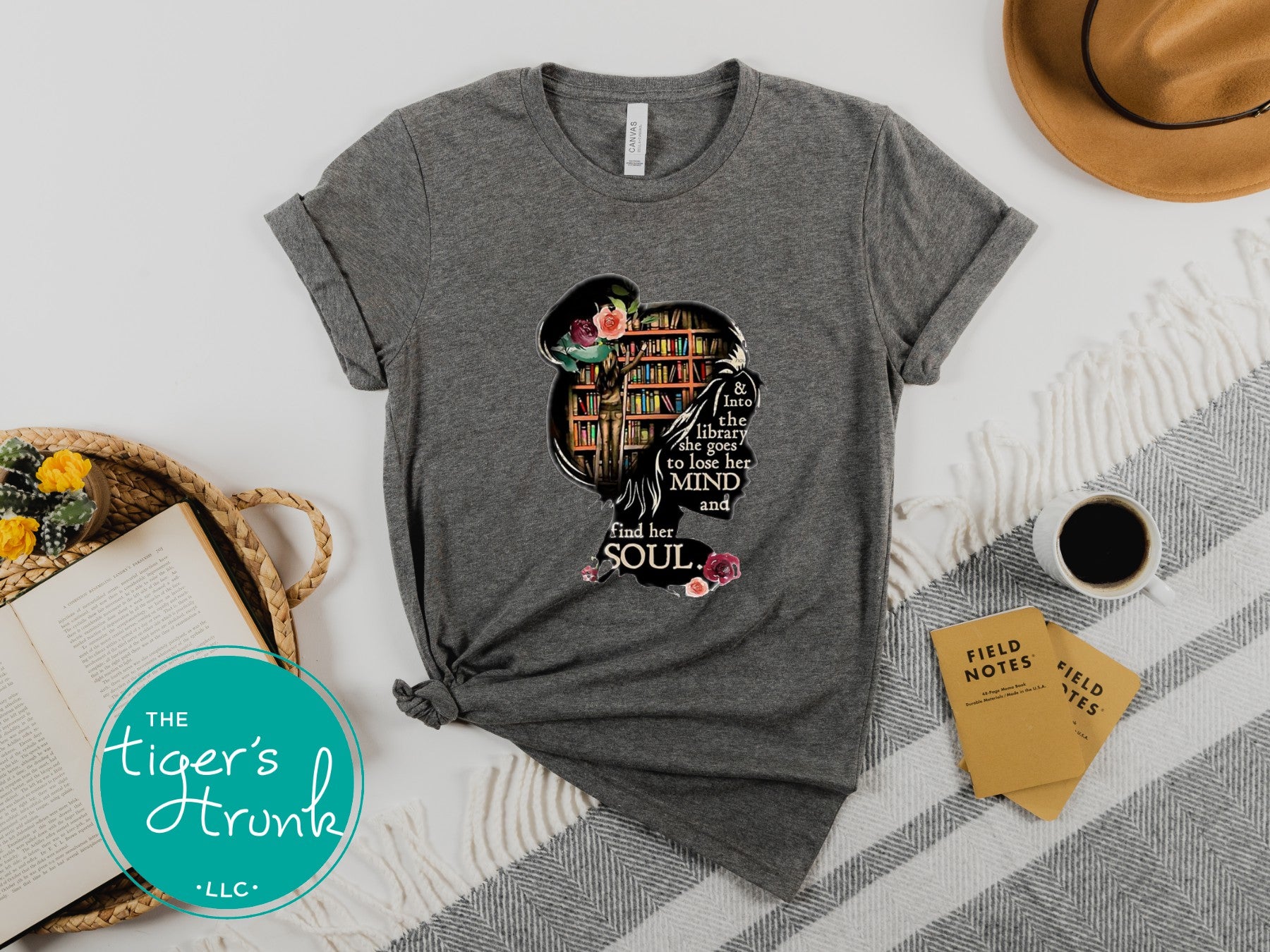 T-shirt with the quote "And to the Library She Goes to Lose Her Mind and Find Her Soul," perfect for readers and book lovers