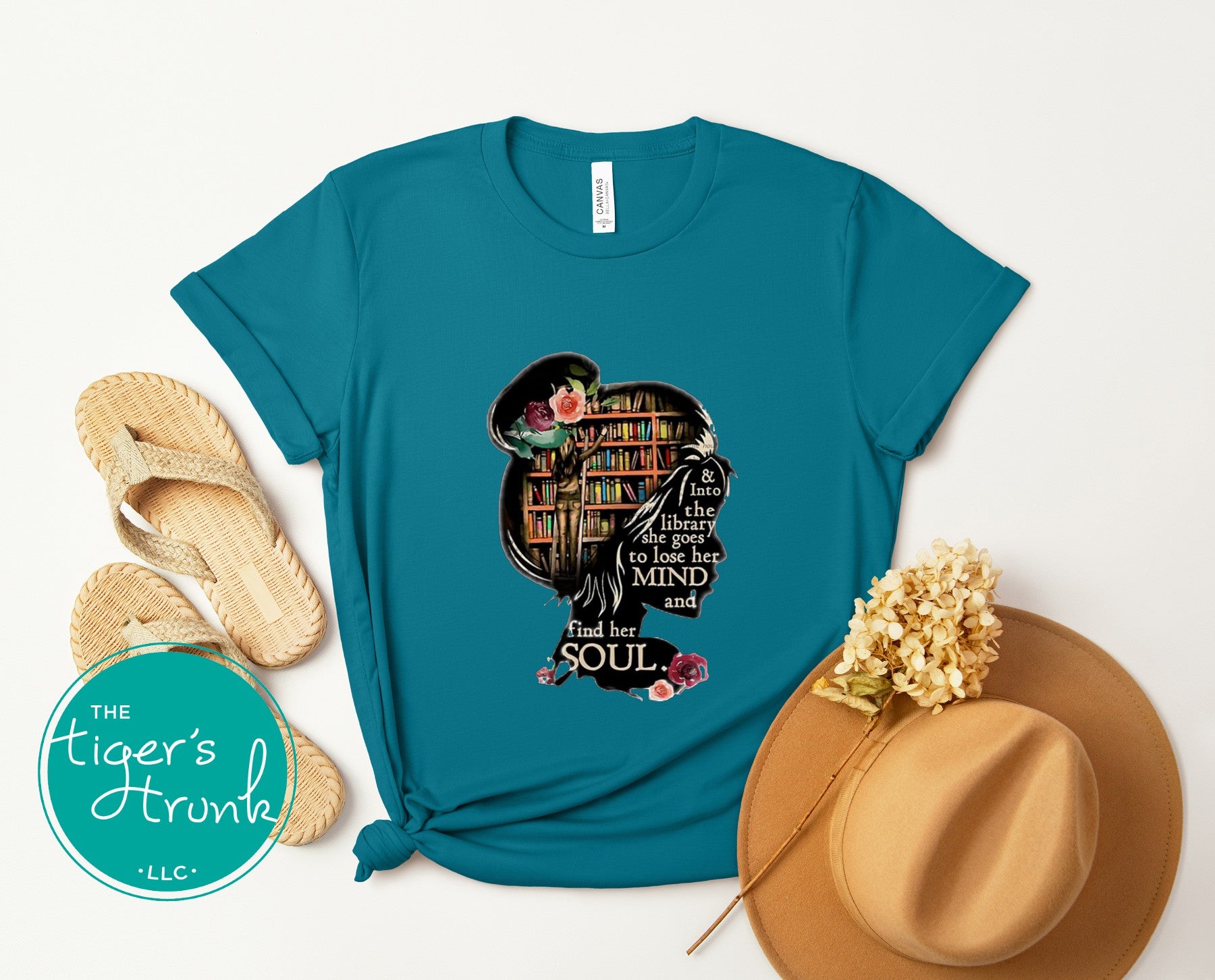 T-shirt with the quote "And to the Library She Goes to Lose Her Mind and Find Her Soul," perfect for readers and book lovers