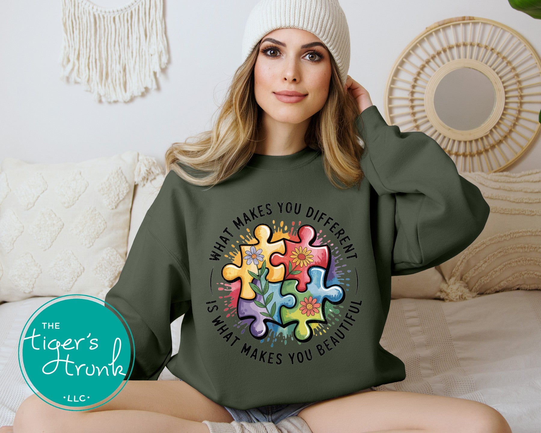 Model wearing military green autism awareness sweatshirt with colorful puzzle design and uplifting message on front