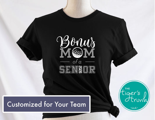 Black t-shirt with 'Bonus Mom of a Senior' text on a mannequin against a white background, featuring the brand 'The Tiger's Trunk'.