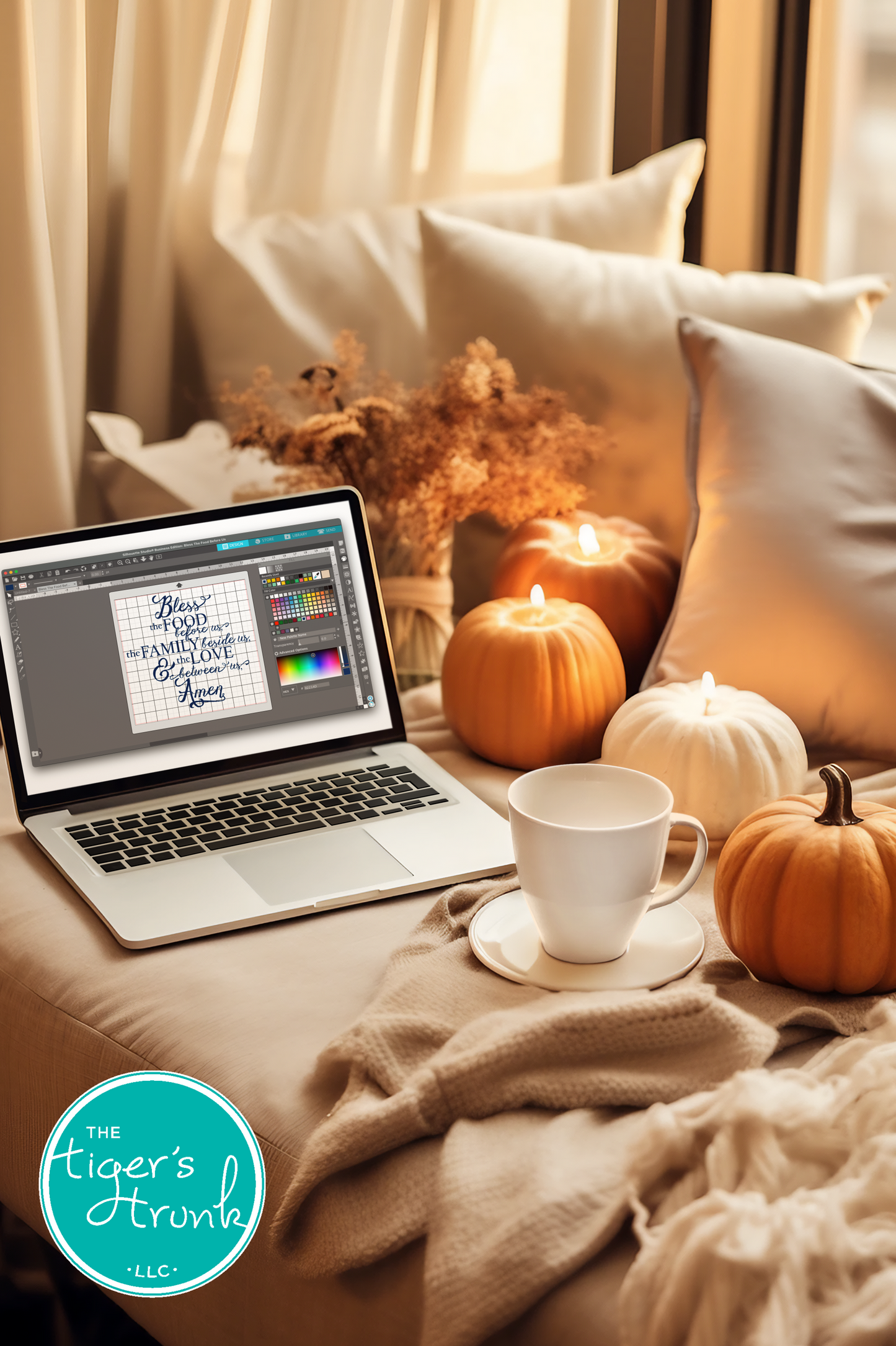Laptop on a couch with a cup, pumpkins, and decorative items, featuring 'The Tiger's Trunk' logo.