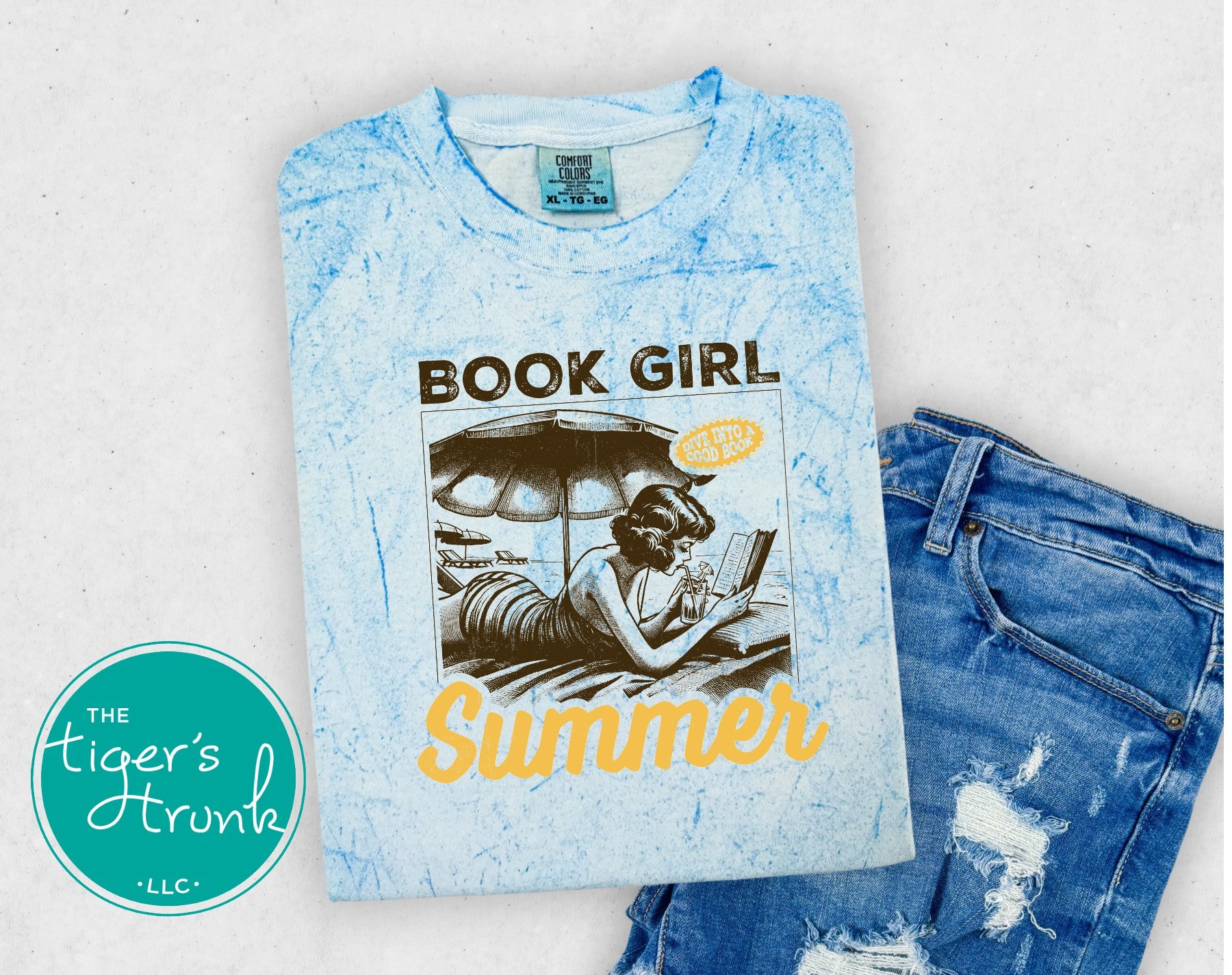 Tie dye t-shirt with the phrase "Dive Into a Good Book," vibrant reading shirt for book lovers, librarians, and literary fans