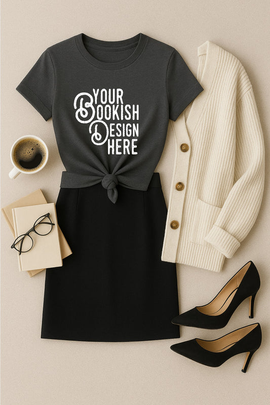Gray t-shirt with 'Your Bookish Design Here' text, black skirt, white cardigan, black high heels, and coffee on a beige surface.