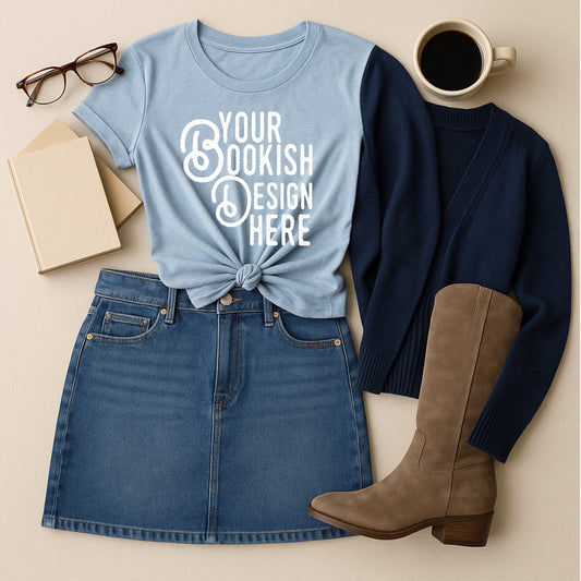 Fashionable outfit with a blue t-shirt, denim skirt, brown boots, and coffee cup on a beige background.