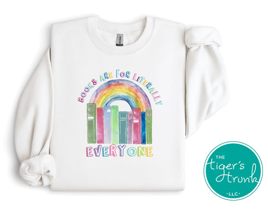 Sweatshirt with pastel rainbow and books graphic, featuring the phrase "Books Are for Literally Everyone," inclusive reading apparel for allies