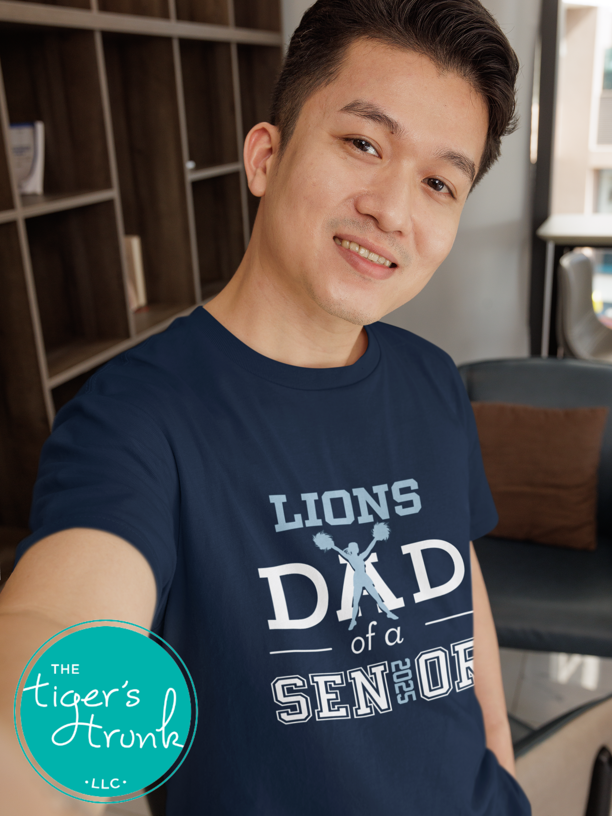 man wearing navy cheer dad of a senior shirt with cheer silhouette