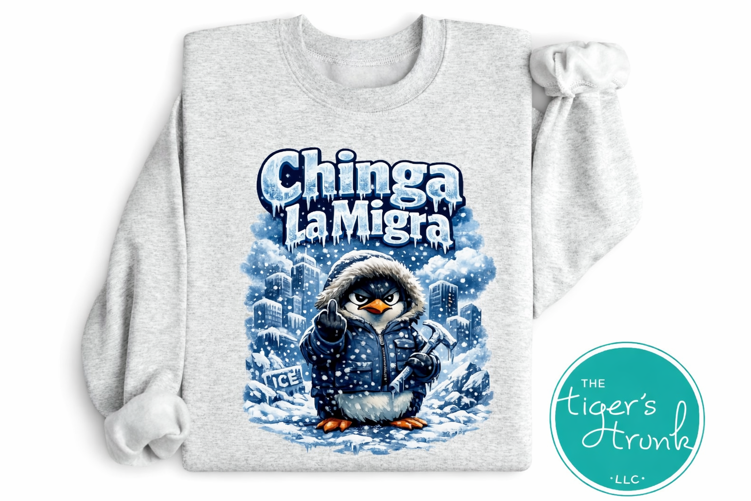 Gray sweatshirt with a penguin graphic and 'Chinga La Migra' text on a white background.