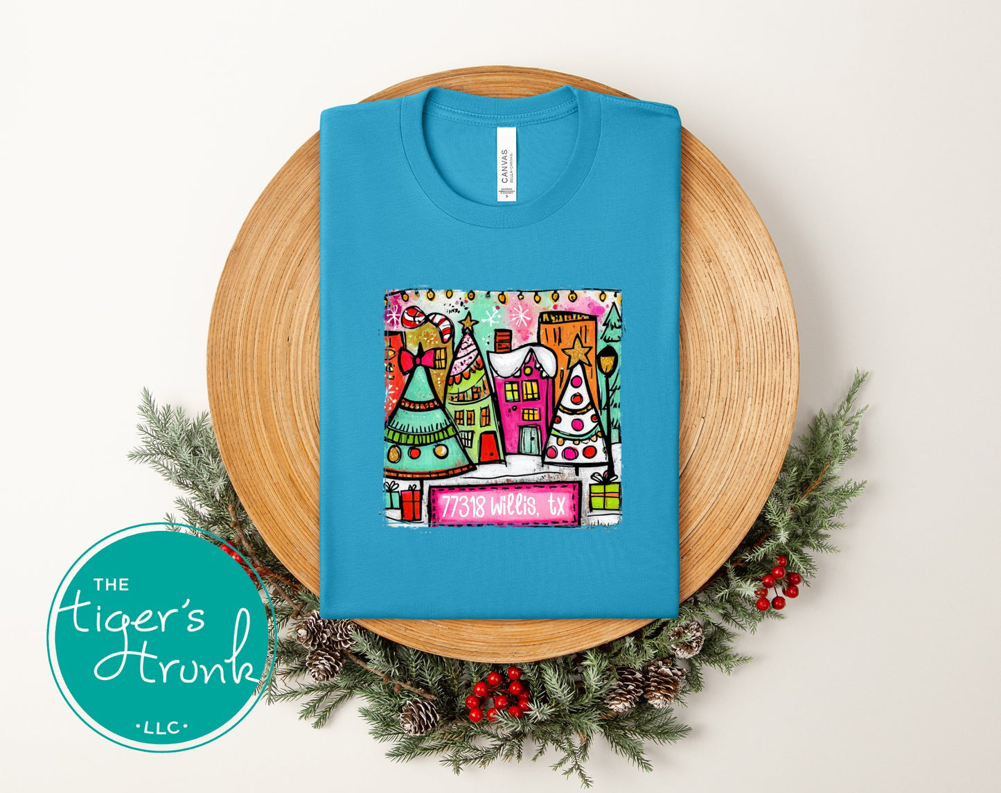 Aqua Christmas town shirt with bright holiday village design and personalized ZIP code 77318 Willis TX