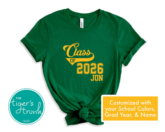 Green t-shirt with 'Class of 2026 JON' text in yellow on a white background, featuring the brand 'The Tiger's Trunk'.