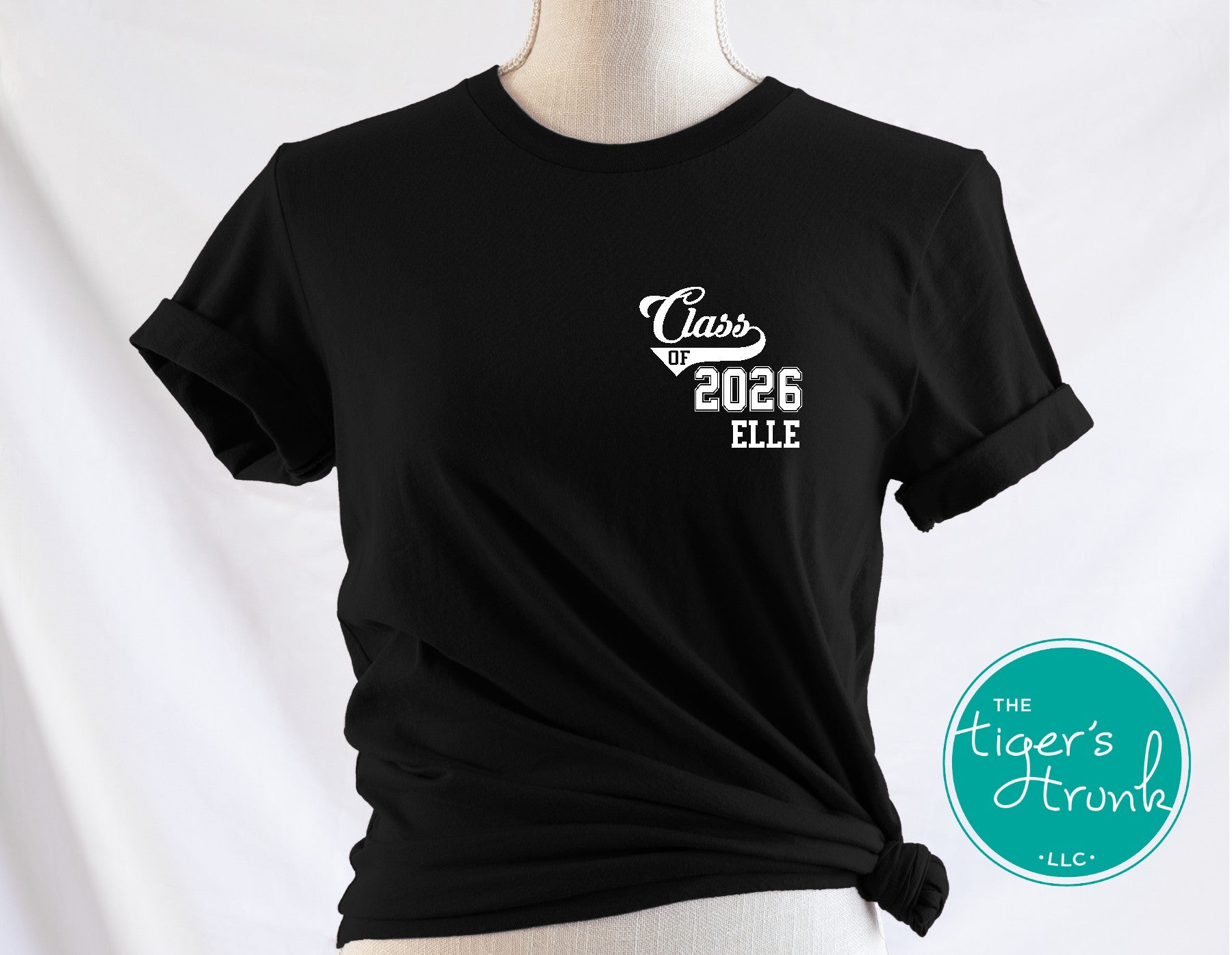 Black t-shirt with 'Class of 2026 ELLE' text on a mannequin against a white background, with 'The Tiger's Strunk LLC' logo.