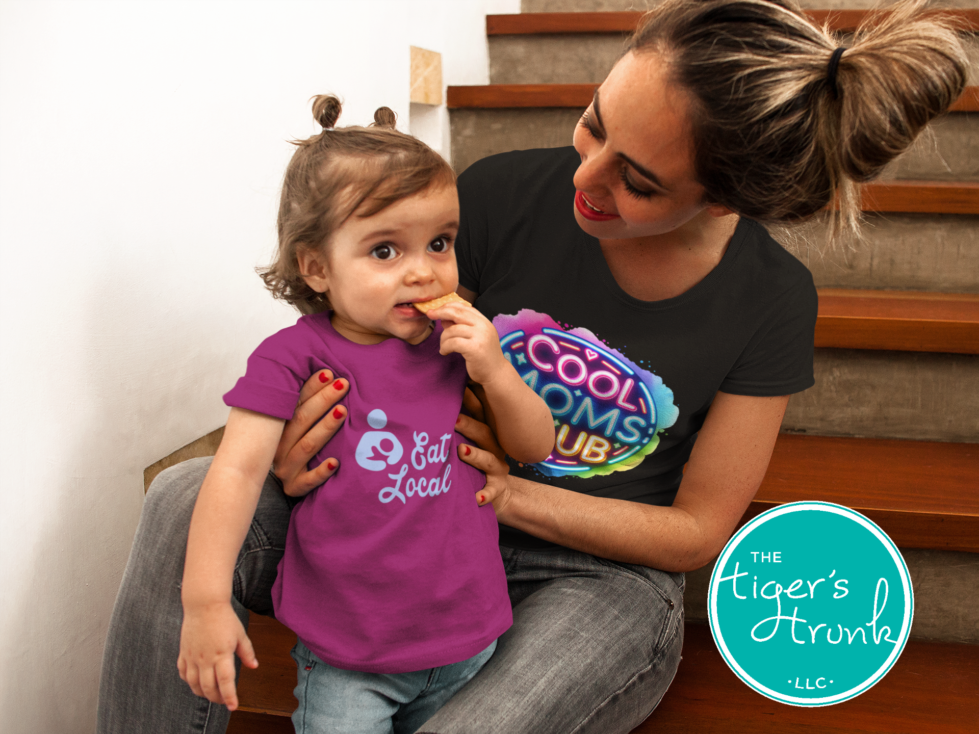 Graphic t-shirt with Cool Mom's Club text in neon colors, fun and trendy design for stylish moms