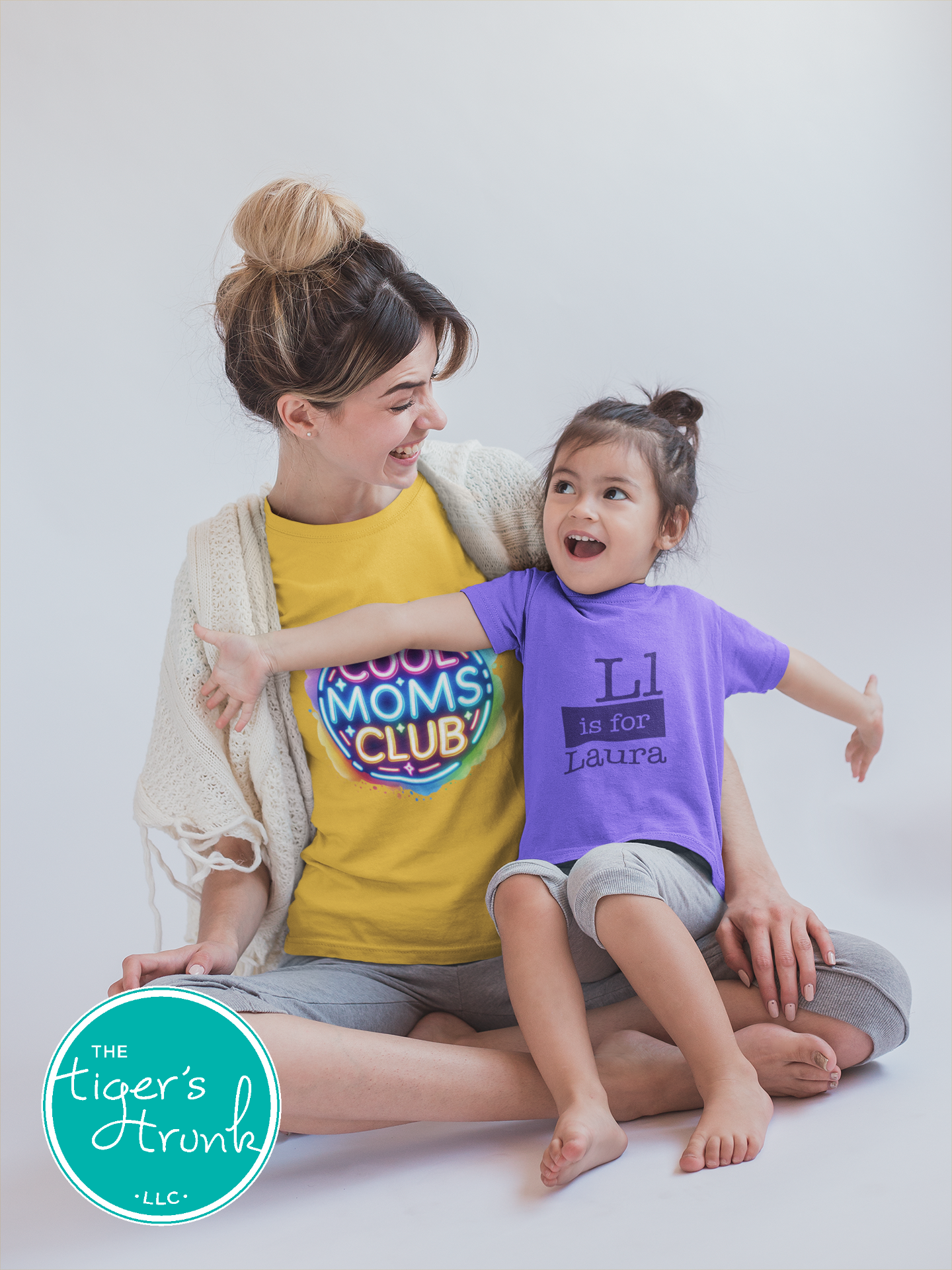 Graphic t-shirt with Cool Mom's Club text in neon colors, fun and trendy design for stylish moms