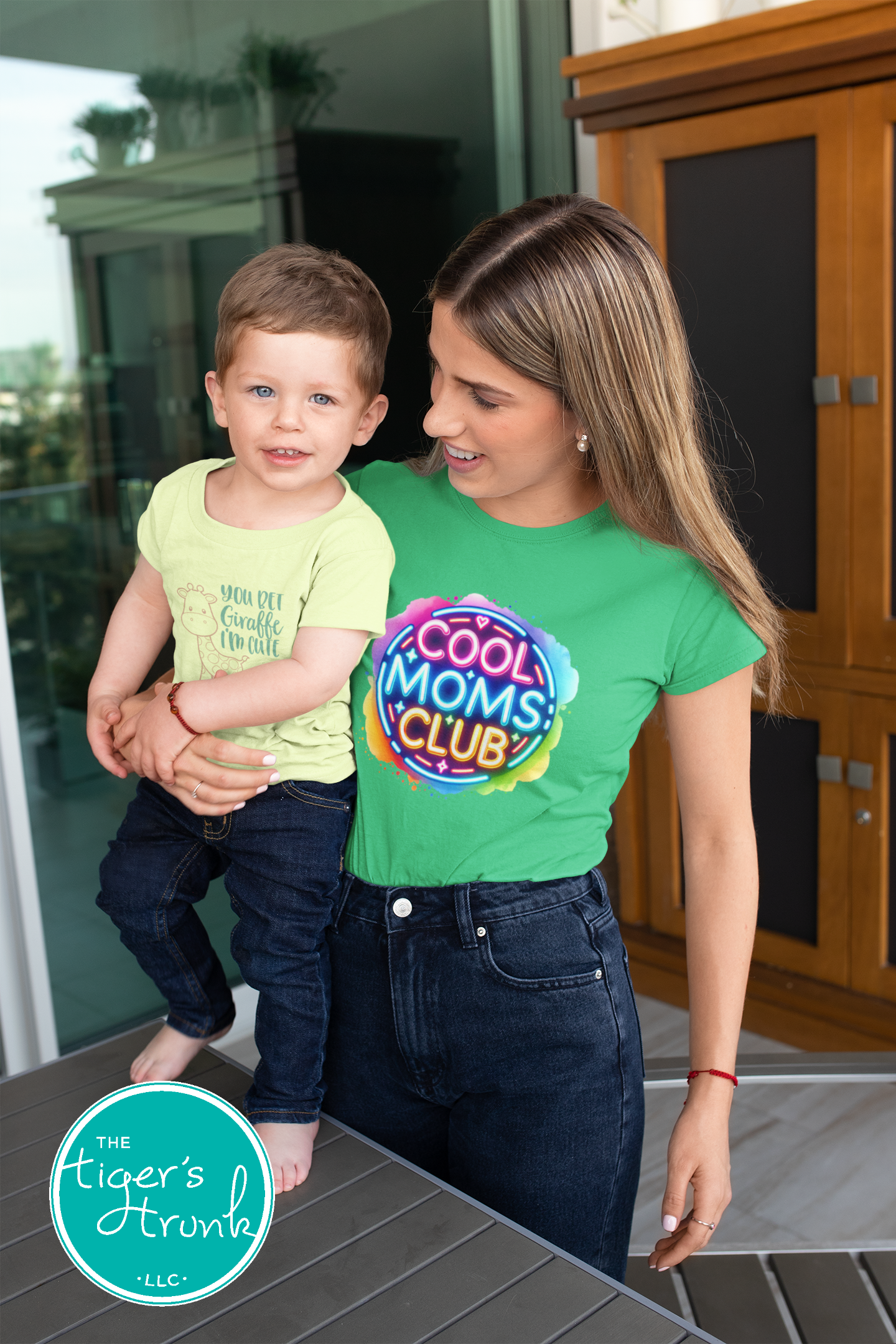 Graphic t-shirt with Cool Mom's Club text in neon colors, fun and trendy design for stylish moms