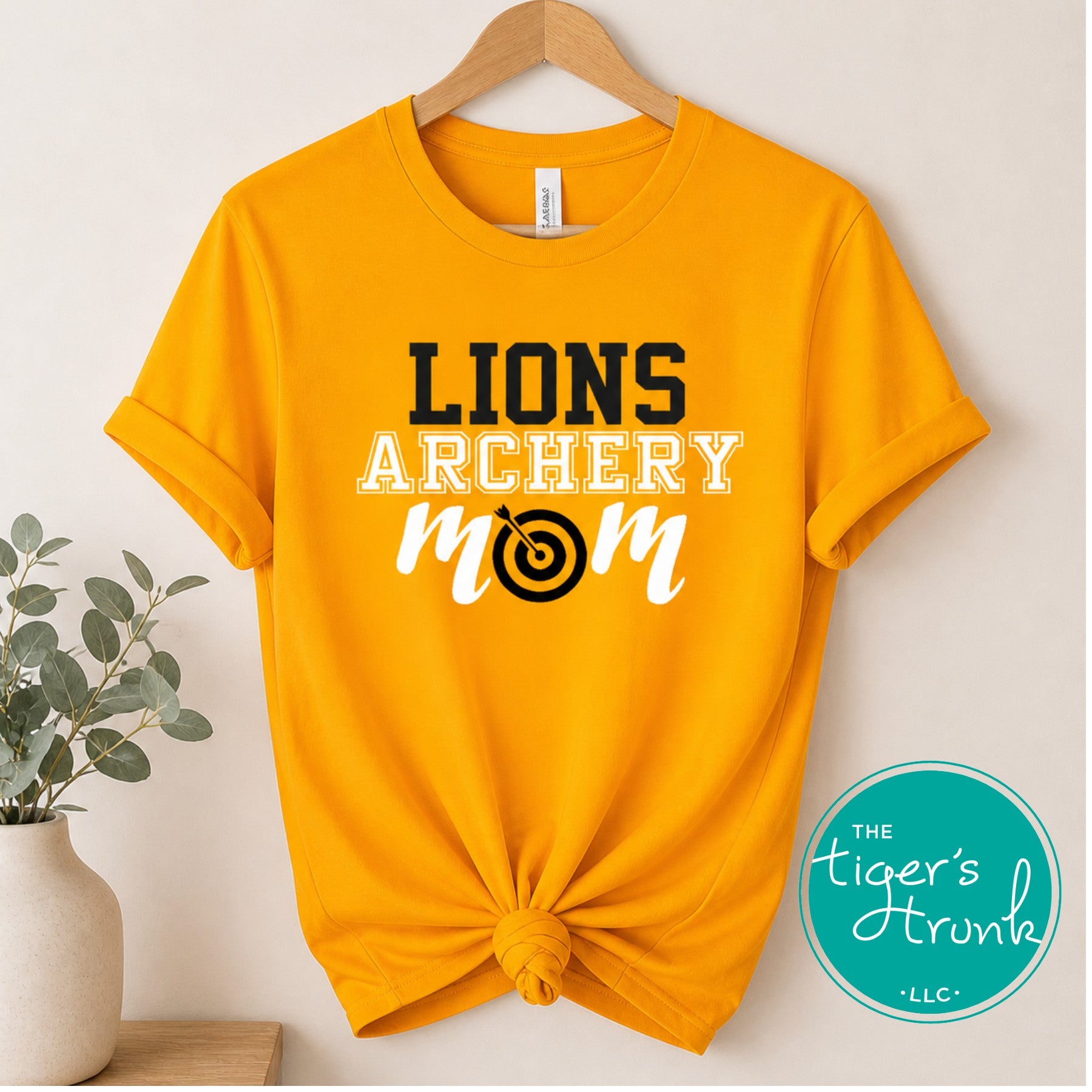 yellow archery mom shirt with customizable team name and colors displayed on knotted t-shirt