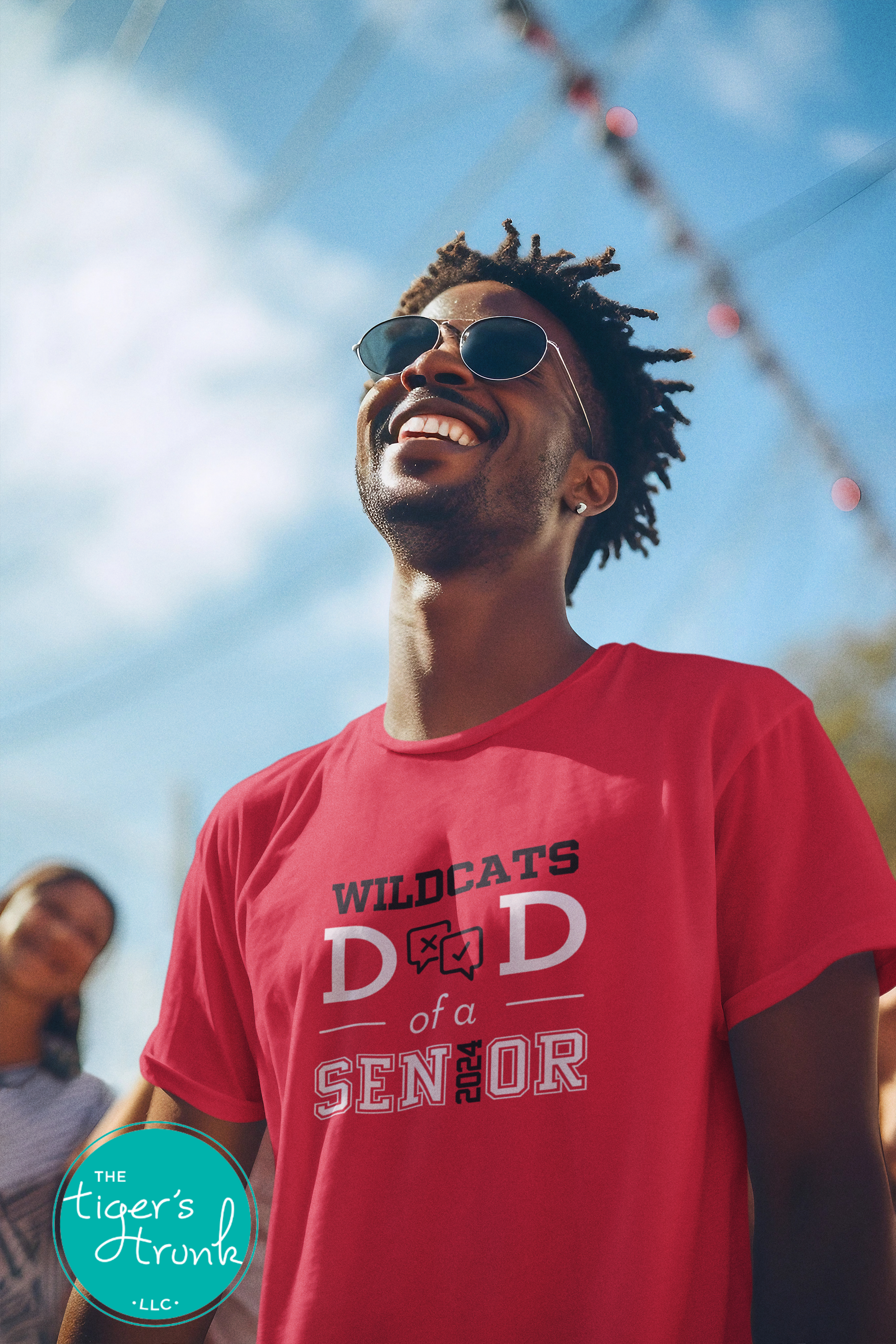 man wearing red debate team dad of a senior shirt personalized with team mascot school colors and graduation year