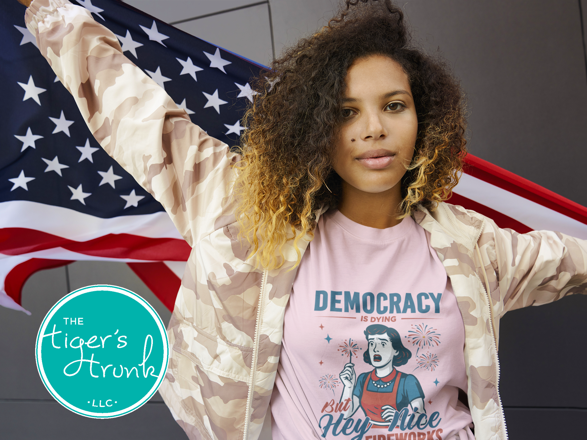 Funny political t-shirt that reads Democracy Is Dying But Hey, Nice Fireworks, worn for sarcastic July Fourth cookouts
