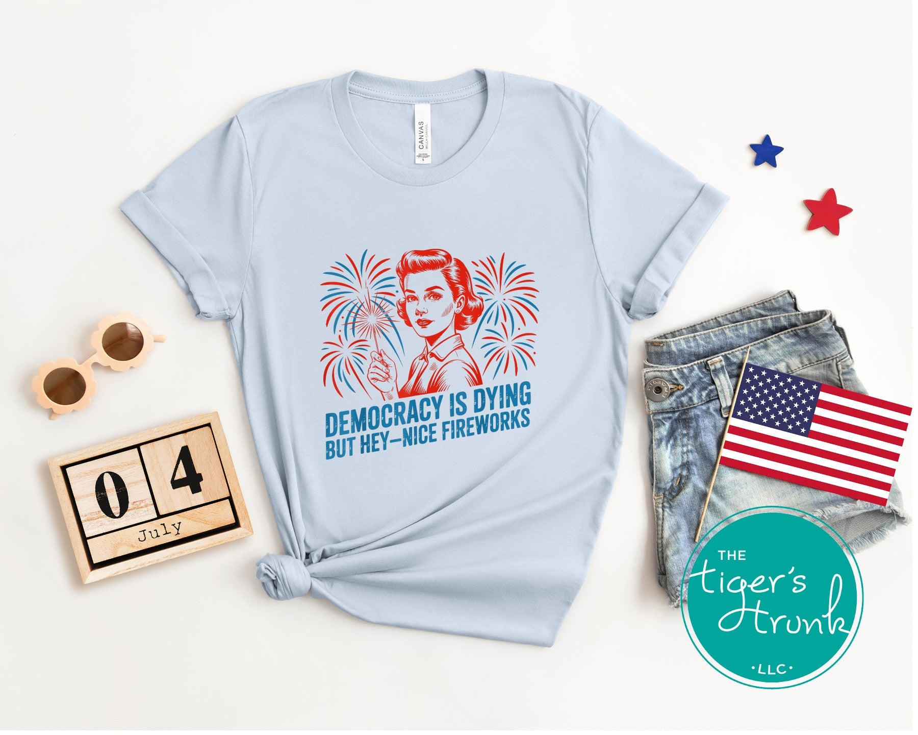 Darkly funny t-shirt that reads Democracy Is Dying But Hey, Nice Fireworks, perfect for sarcastic Independence Day wear