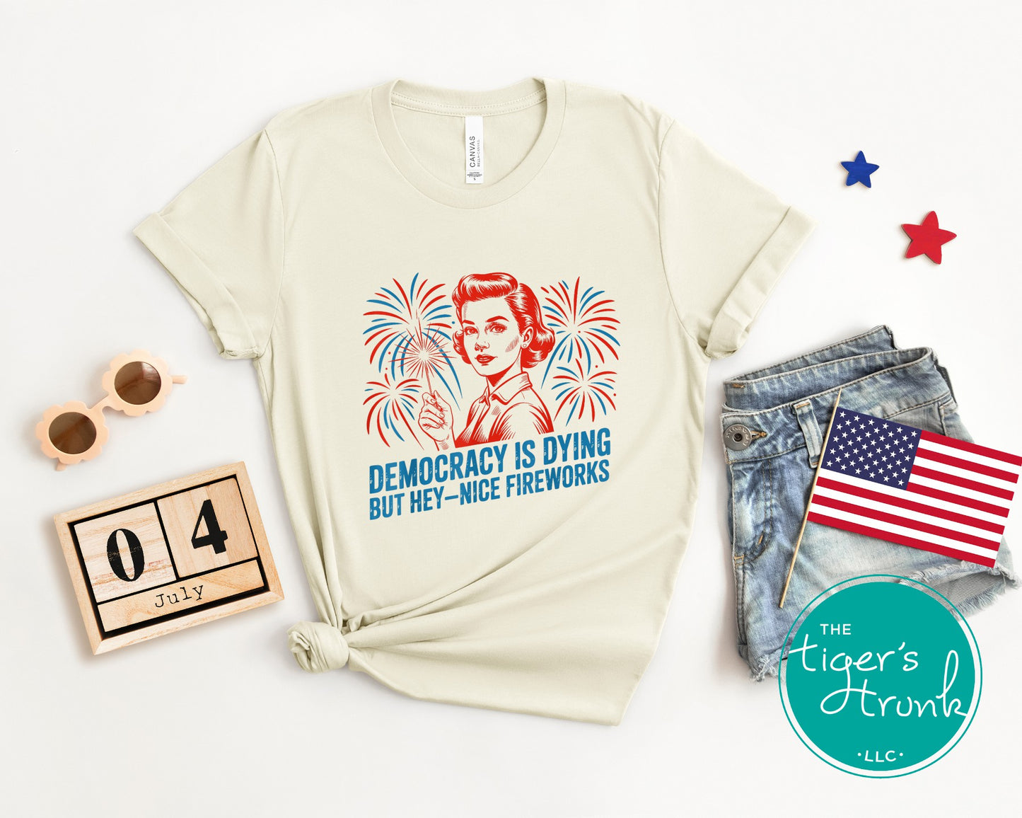 Darkly funny t-shirt that reads Democracy Is Dying But Hey, Nice Fireworks, perfect for sarcastic Independence Day wear