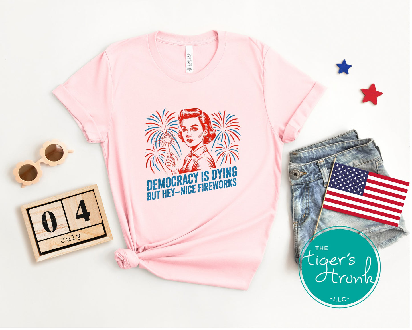 Darkly funny t-shirt that reads Democracy Is Dying But Hey, Nice Fireworks, perfect for sarcastic Independence Day wear