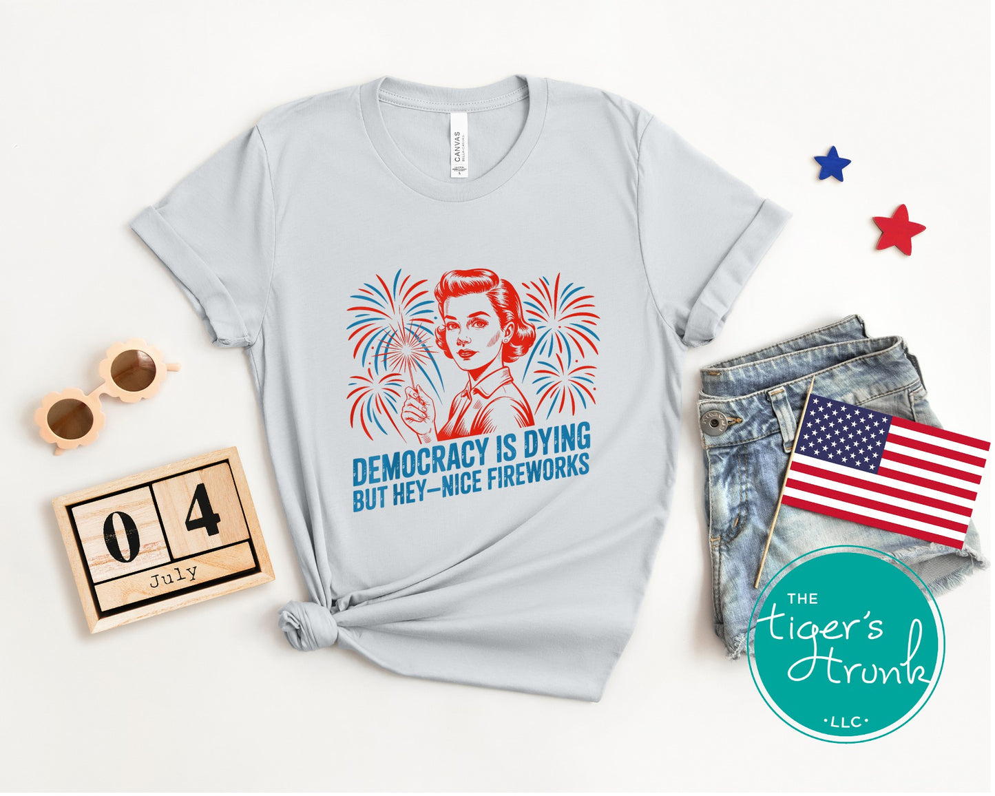 Darkly funny t-shirt that reads Democracy Is Dying But Hey, Nice Fireworks, perfect for sarcastic Independence Day wear