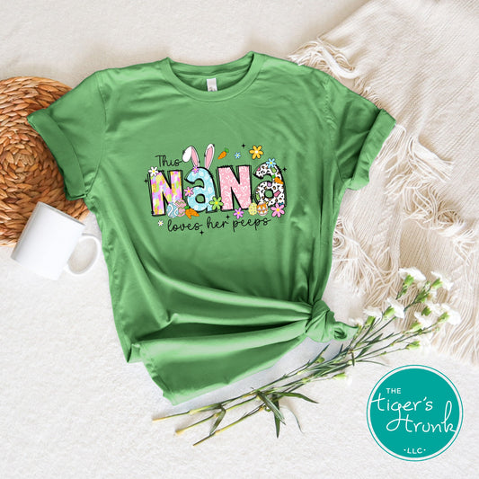 Easter t-shirt with "Nana" in pastel spring print font with bunnies, eggs, and flowers, perfect for holiday gatherings and egg hunts