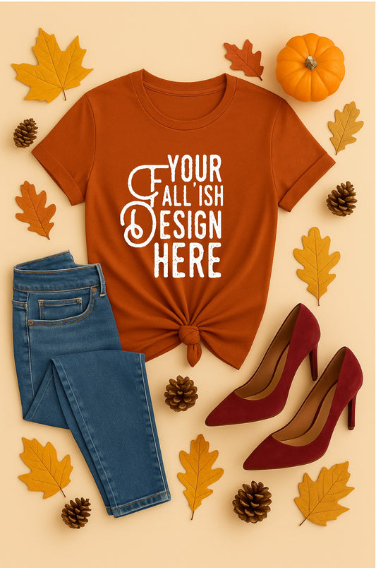Autumn t-shirt with 'Your Fall'ish Design Here' text, blue jeans, red high heels, and fall-themed decor on a beige background.