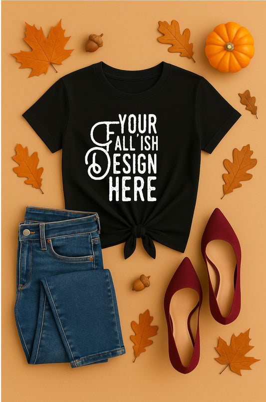 Black t-shirt with customizable text, blue jeans, red shoes, and autumn leaves on a beige background