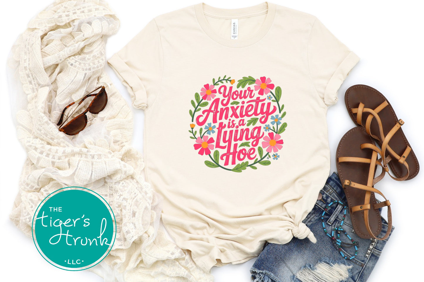 Natural colored floral anxiety graphic shirt styled with scarf sandals and denim shorts