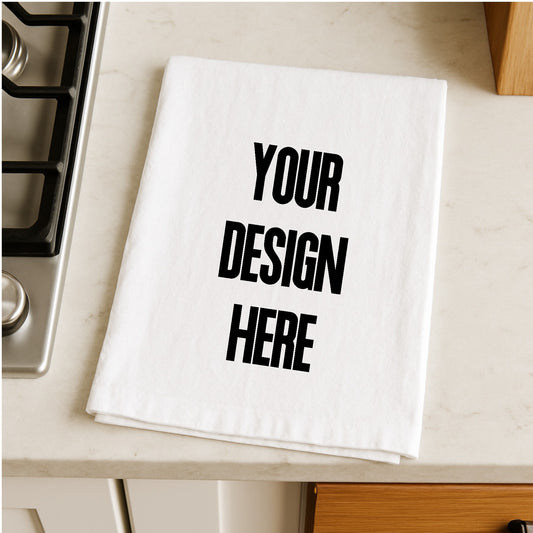White towel with 'Your Design Here' text on a kitchen counter
