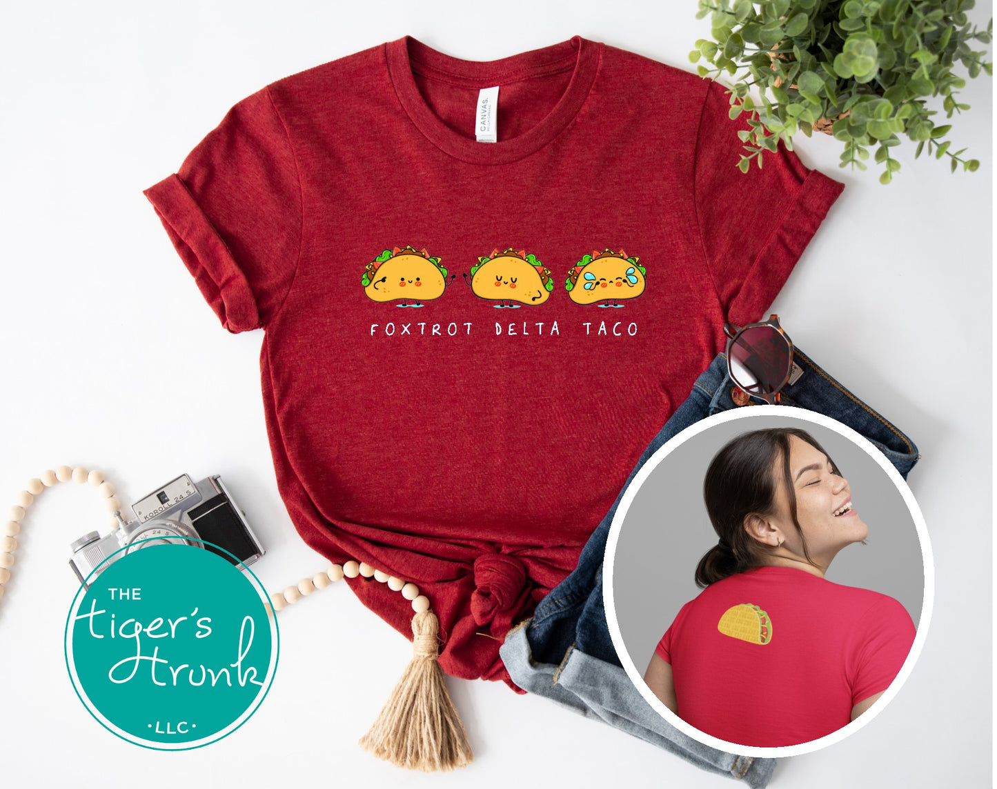 Red t-shirt with taco design and 'Foxtrot Delta Taco' text, displayed with jeans and a plant.