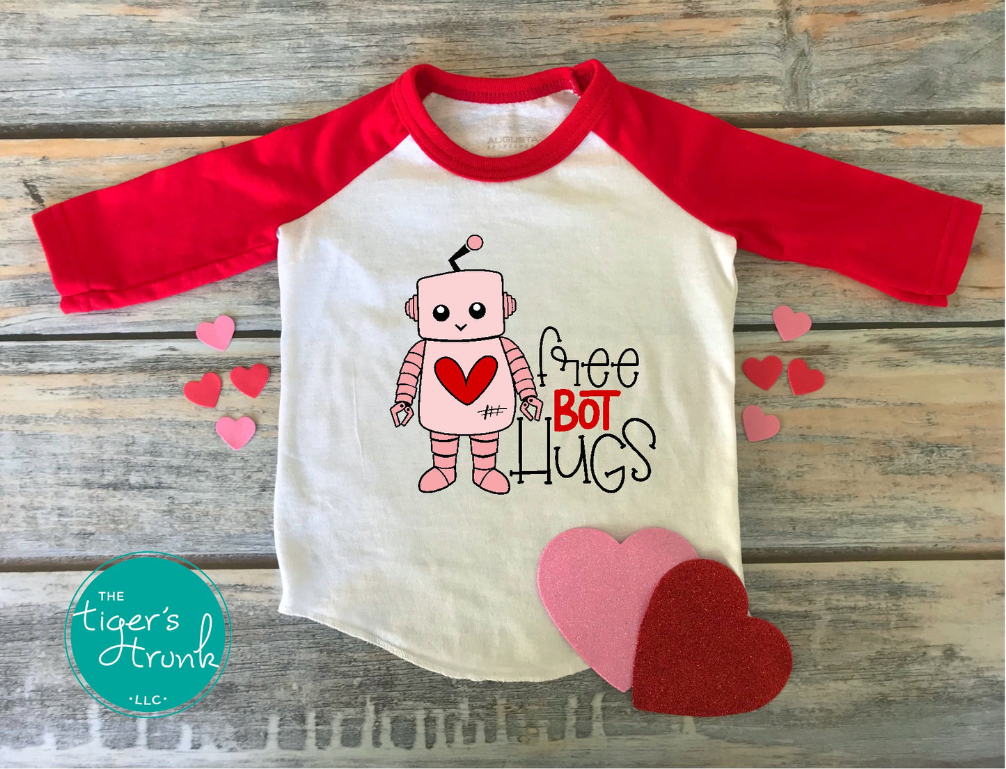 Kids Valentine’s Day shirt with the phrase Free Bot Hugs, a fun STEM-inspired robot design for young tech enthusiasts."