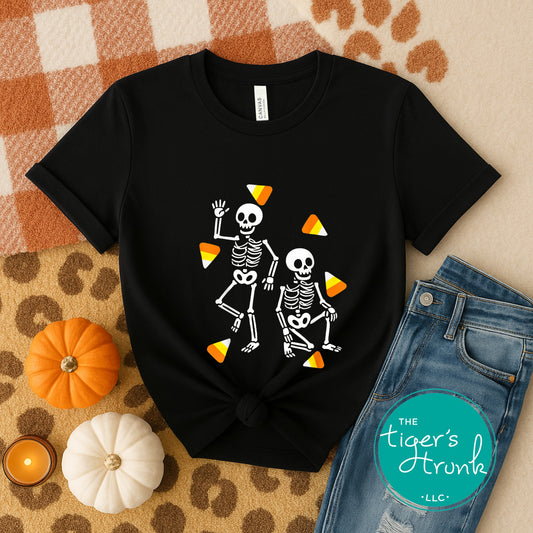 Black t-shirt with skeleton design on a checkered fabric background