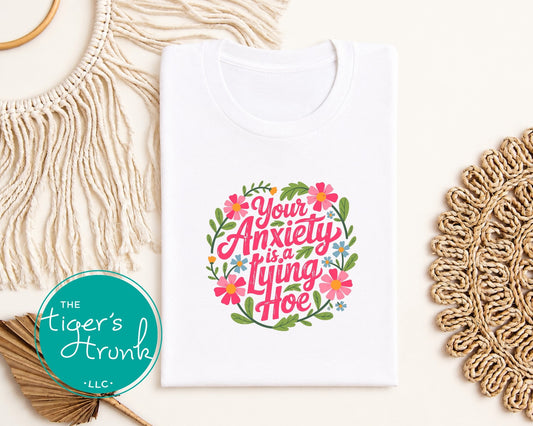 White graphic t-shirt with colorful floral Your Anxiety Is a Lying Hoe design