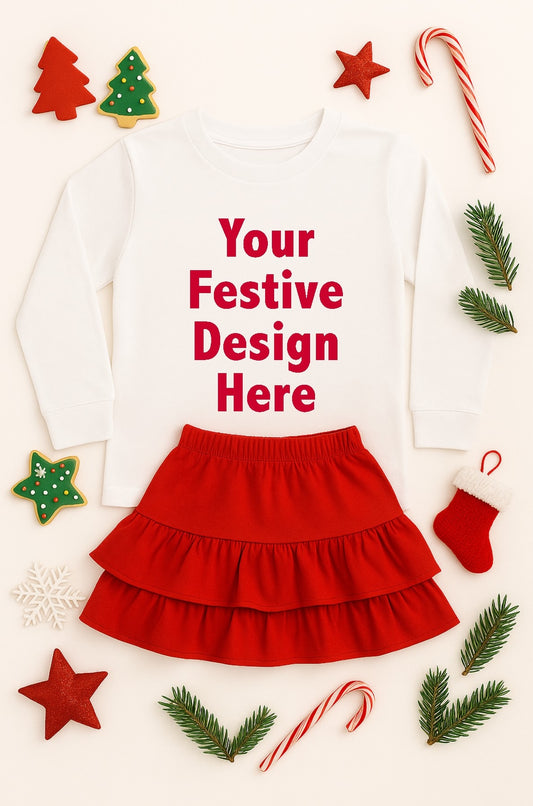 Children's outfit with red skirt and white top surrounded by Christmas decorations on a light background
