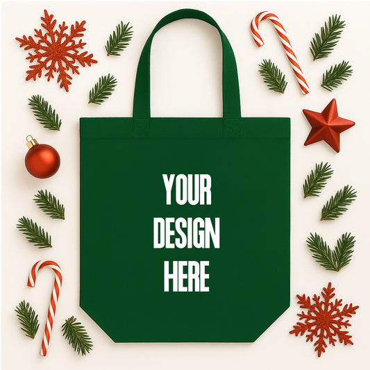 Green tote bag with 'Your Design Here' text surrounded by Christmas decorations on a white background